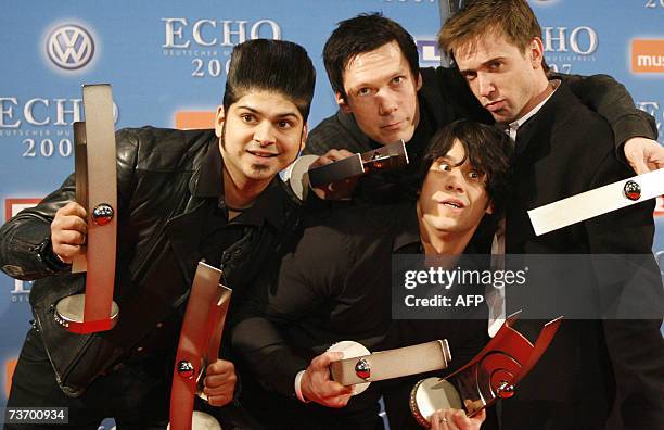 Members of the Canadian band "Billy Talent" present their trophies after being awarded the Echo music prize in the category "best group international...