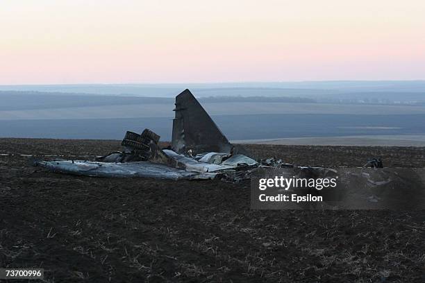 Military personnel investigate the crash site and debris from two MIG-29 fighter jets is seen on March 21, 2007 in Millerovo, Rostov region, in...