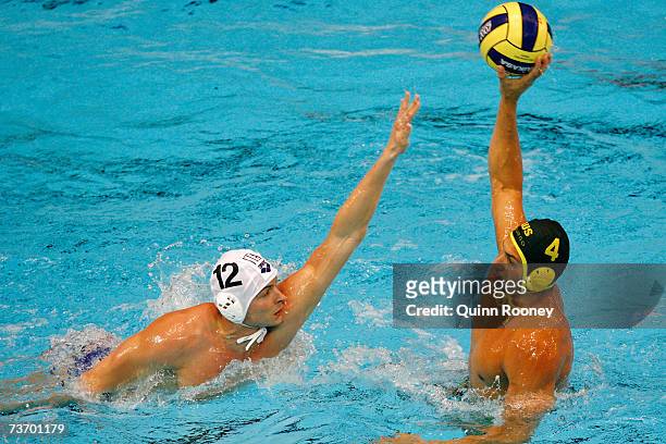 Pietro Figlioli of Australia looks for the pass past Goran Fiorentini of Italy in the Men's Final Round Water Polo match between Italy and Australia...