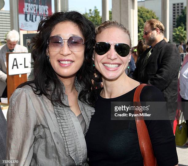 Actress Sandra Oh and guest arrive at the World Premier performance of Lisa Loomer's "Distracted" presented at CTG/Mark Taper Forum on March 25, 2007...