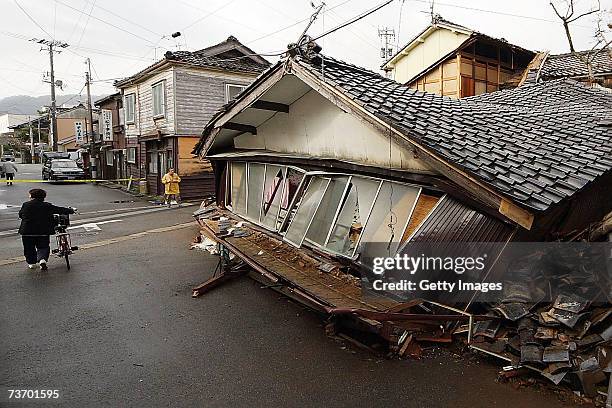 Collapsed houses are seen after an earthquake struck off the west coast of Japan's Largest Island Honshu, on March 26, 2007 in Wajima, Ishikawa...