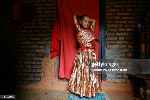 Kumari Devi Sajani Shakya gets ready for puja on March 24, 2007 in Bhaktapur, Nepal. As a royal Kumari, Sajani has a very different life from the...