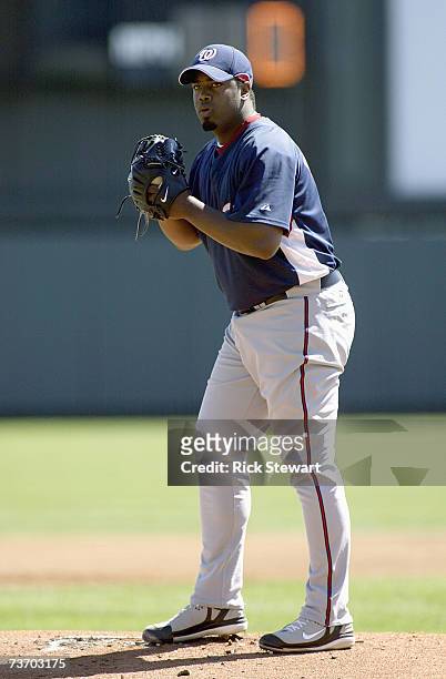 Jerome Williams of the Washington Nationals lines up the pitch during a Spring Training game against the Atlanta Braves at The Ballpark at Disney's...