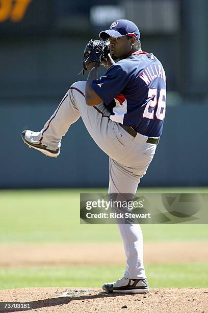 Jerome Williams of the Washington Nationals delivers the pitch during a Spring Training game against the Atlanta Braves at The Ballpark at Disney's...