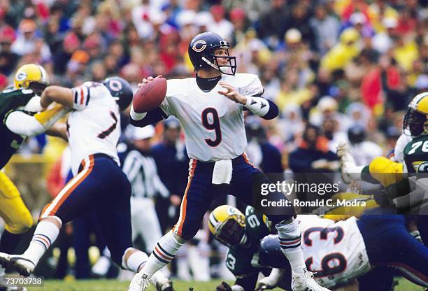 Quarterback Jim McMahon of the Chicago Bears passing against the Green Bay Packers during a game on November 29, 1987 in Chicago, Illinois.