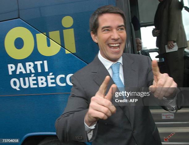 The leader of the separatist Parti Quebecois, Andre Boisclair boards his campaign bus after voting in the 26 March 2007, in Montreal, as voters of...