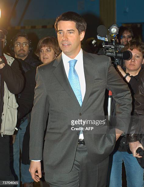 The leader of the separatist Parti Quebecois, Andre Boisclair leaves the polling station after voting 26 March 2007, in Montreal, as voters of the...