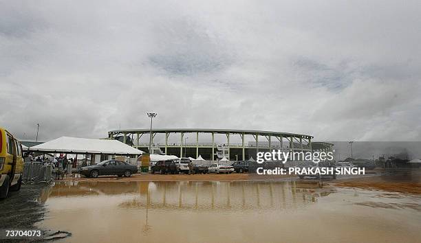 Water logs the parking area as it rains at Guyana National Stadium in Georgetown 26 March 2007. Sri Lanka will play South Africa on 28 March in the...