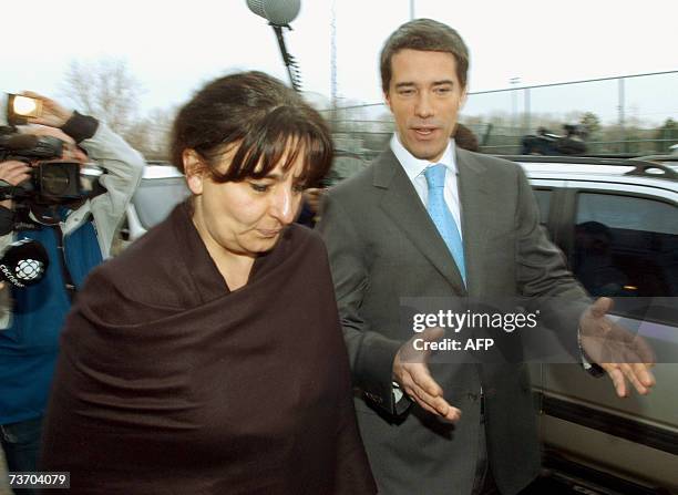 The leader of the separatist Parti Quebecois, Andre Boisclair, and his Chief of Staff, Lyne-Sylvie Perron leave the polling station after voting 26...