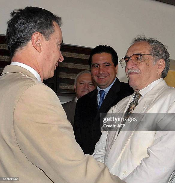 Colombian President Alvaro Uribe speaks with Colombian writer and Nobel Prize laureate Gabriel Garcia Marquez observed by Panamanian President Martin...