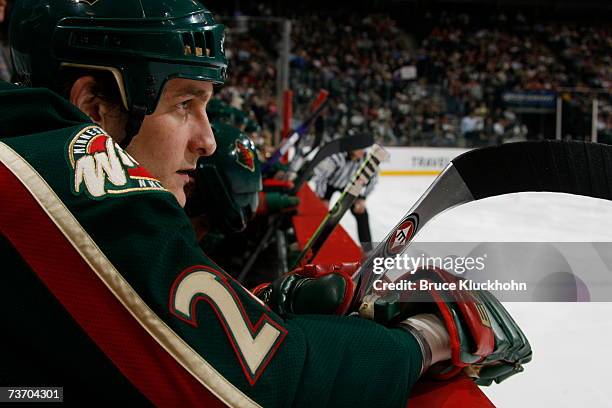 Derek Boogaard of the Minnesota Wild watches play against the St. Louis Blues during the game at Xcel Energy Center on March 22, 2007 in Saint Paul,...