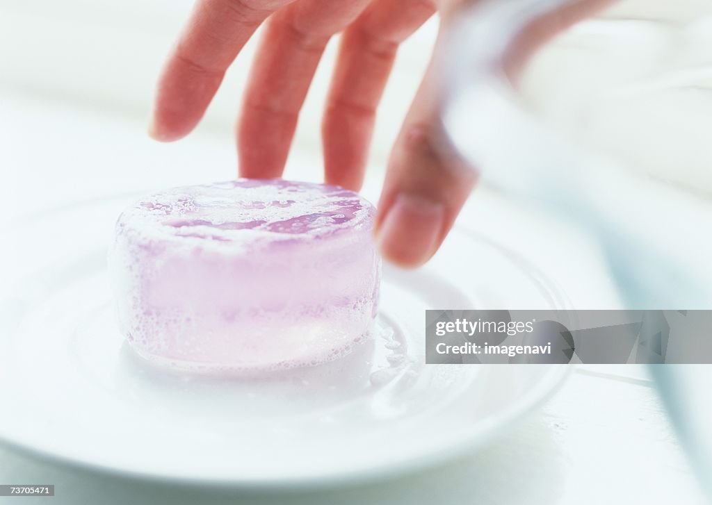 Hand, soap and soap dish