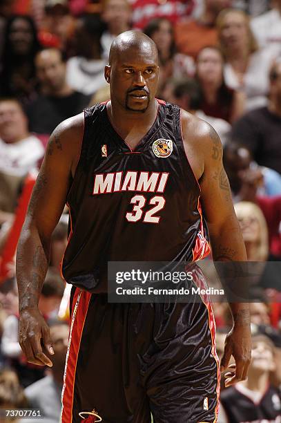 Shaquille O'Neal of the Miami Heat stands on the court during the NBA game against the Washington Wizards at American Airlines Arena on March 11,...