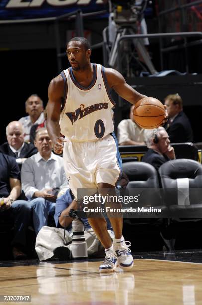 Gilbert Arenas of the Washington Wizards controls the ball during the NBA game against the Miami Heat at American Airlines Arena on March 11, 2007 in...
