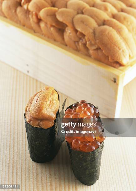 salmon roe and sea urchin sushi - ikura stock pictures, royalty-free photos & images