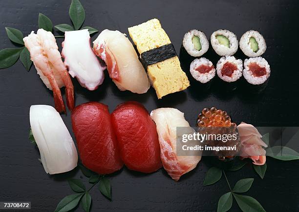 assorted sushi - gunkanmaki stock-fotos und bilder