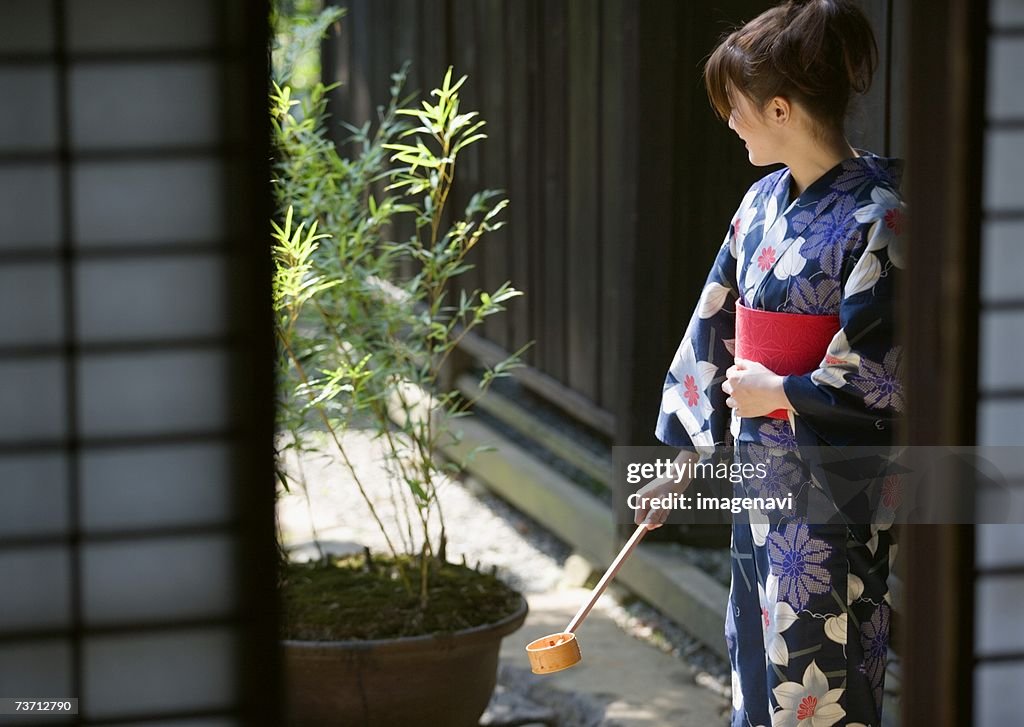 Woman watering with wearing Yukata