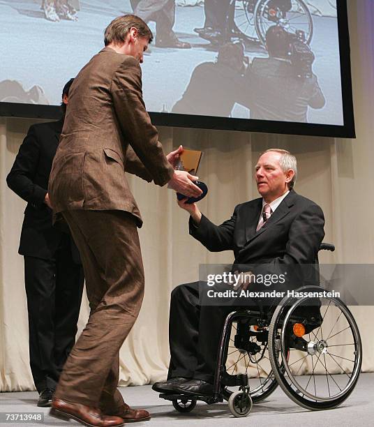 Presenter Guenther Jauch receives his Herbert Award for the Best TV Sportpresenter from German Minister of Interior Wolfgang Schaeuble at the Herbert...