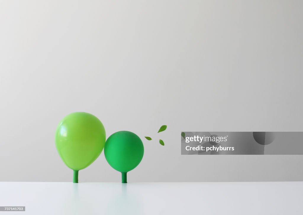 Conceptual green balloons as trees