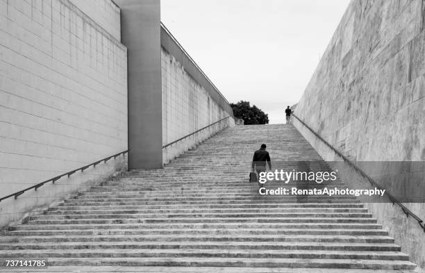 businessman walking up steps, valletta, malta - malta business stock pictures, royalty-free photos & images