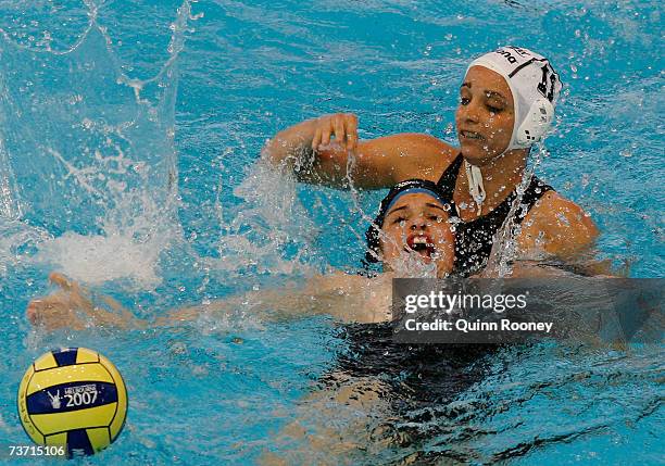 Agnes Valkai of Hungary competes for the ball with Katrina Monton of Canada during the Women's Quarter Final Round Water Polo match between Hungary...