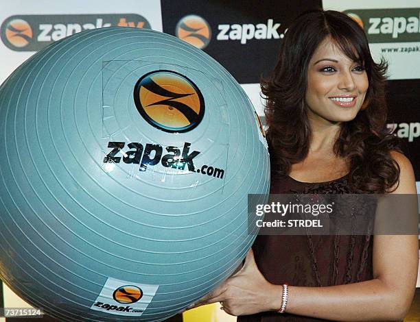 In this picture taken 04 January 2007, Indian film actress Bipasha Basu poses for photographers at the launch of an audio-visual action game called...