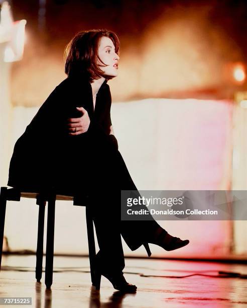 Actress Gillian Anderson poses during a photo shoot for TV Guide in 1998 at a studio in Vancouver, Canada.