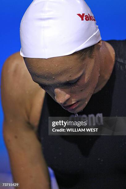 Laure Manaudou of France is seen after being beaten by Natalie Coughlin of the US in the women's 100m backstroke final 27 March 2007 in Melbourne at...