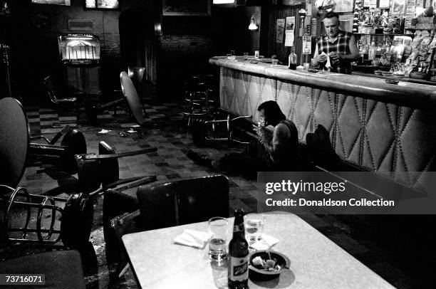 Actors Dennis Hopper and Viggo Mortensen on location during filming of the movie "The Indian Runner" in 1989 in Omaha, Nebraska.