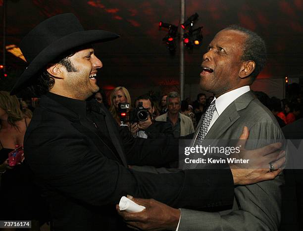 Actor Sidney Poitier and director Robert Rodriguez talk at the afterparty for the premiere at Dimension Films "Grindhouse" featuring Robert...