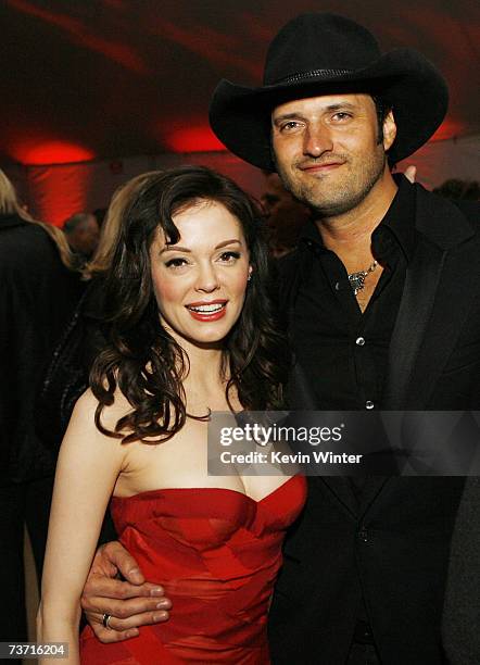 Actress Rose McGowan and director Robert Rodriguez pose at the afterparty for the premiere at Dimension Films "Grindhouse" featuring Robert...
