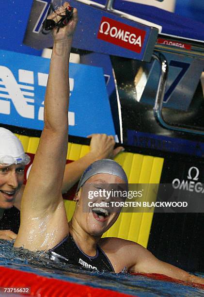 Federica Pellegrini of Italy celebrates victory in the womans 200m freestyle at the 12th FINA World Swimming Championships in Melbourne, 27 March...