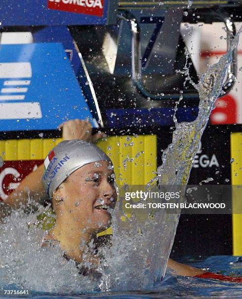Federica Pellegrini of Italy celebrates victory in the womans 200m freestyle at the 12th FINA World Swimming Championships in Melbourne, 27 March...