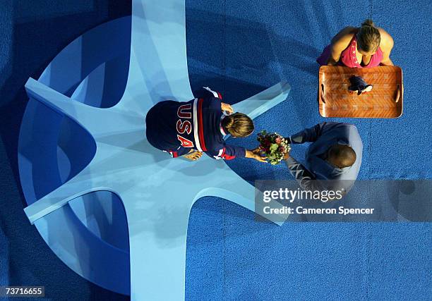 Natalie Coughlin of the United States of America accepts her medal for the Women's 100m Backstroke final during the XII FINA World Championships at...
