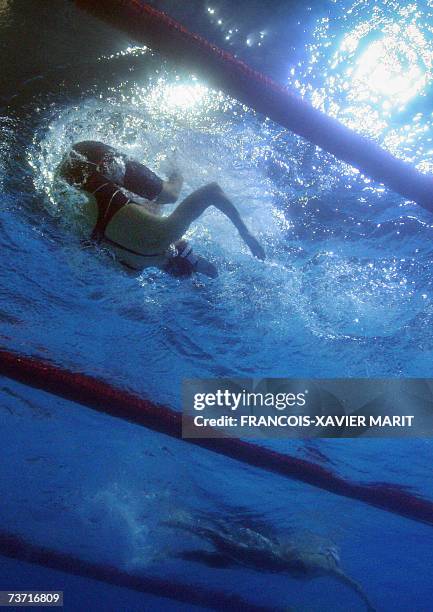 This underwater image shows Linda Mackenzie of Australia and Katie Hoff of the US swimming in the woman's 200m freestyle semifinals, 27 March 2007 at...