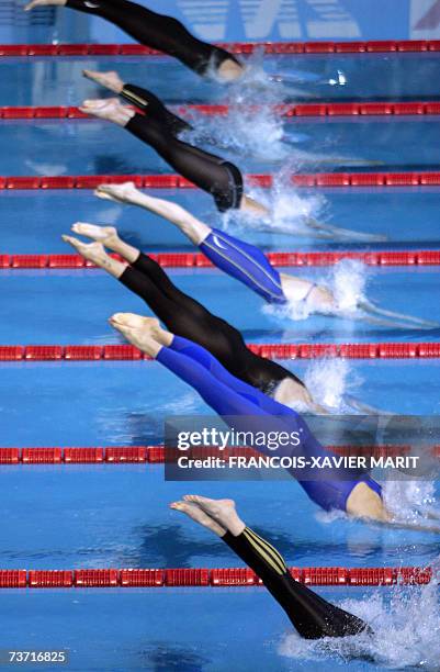 Woman competitors dive off the blocks, 27 March 2007 at the 12th FINA World Swimming Championships. AFP PHOTO / FRANCOIS-XAVIER MARIT