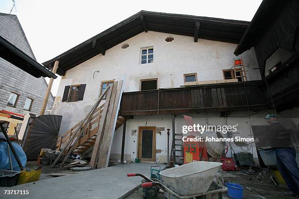 Tradesman works in the backyard of the house where Pope Benedict XVI was born on March 27, 2007 in Marktl, Germany. The Pope's birthplace is...