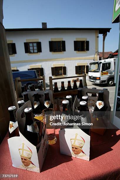 Beer packs decorated with the Pope's portrait are displayed opposite to the birthplace of Pope Benedict XVI on March 27, 2007 in Marktl, Germany. The...