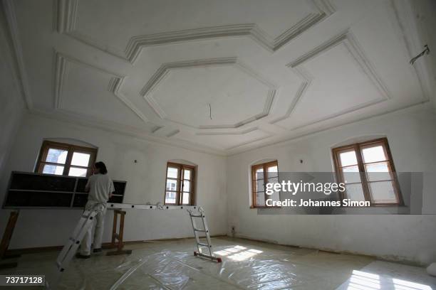 Painter works inside the house where Pope Benedict XVI was born on March 27, 2007 in Marktl, Germany. The Pope's birthplace is currently under...