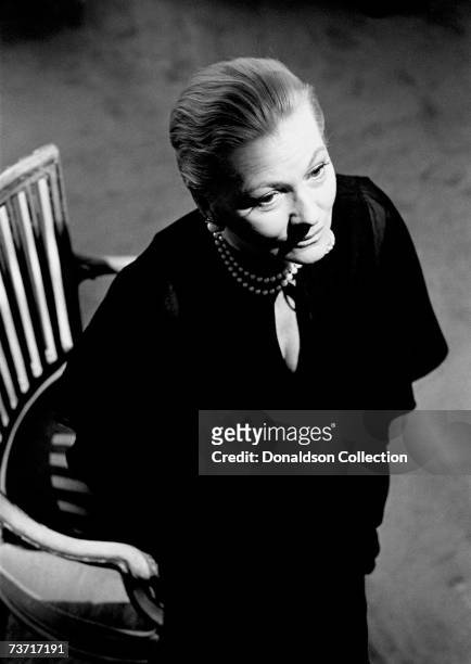 Actress Joan Fontaine poses during a photo shoot held in 1977 at her residence in New York.