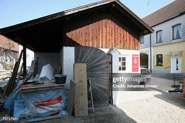 Renovation materials stand outside the entrance office to the house where Pope Benedict's XVI was born on March 27, 2007 in Marktl, Germany. The...