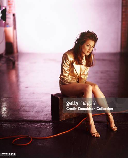 Actress Julianne Moore poses for a magazine shoot in 1994 at a studio, in Los Angeles, California.