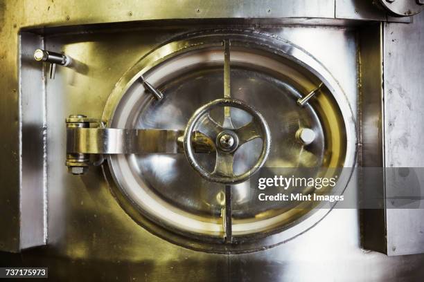 close up of hatch of a large stainless steel kettle in a brewery. - vat stock pictures, royalty-free photos & images