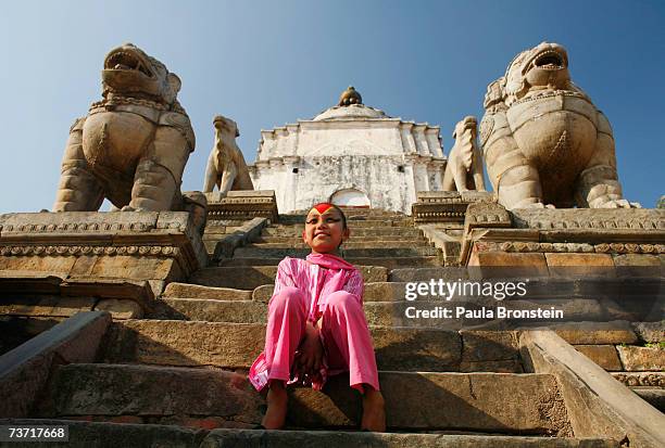 Kumari Devi Sajani Shakya poses at a temple in Durbar Square on March 27, 2007 in Bhaktapur, Nepal. As a royal Kumari, Sajani has a very different...