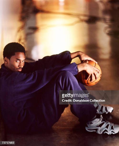Lakers basketball star Kobe Bryant poses for a magazine shoot held in 1999 at the Coliseum, in Los Angeles, California.