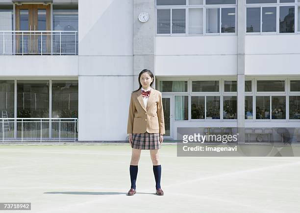 teenagegirl standing on open field - japan 12 years girl stock pictures, royalty-free photos & images