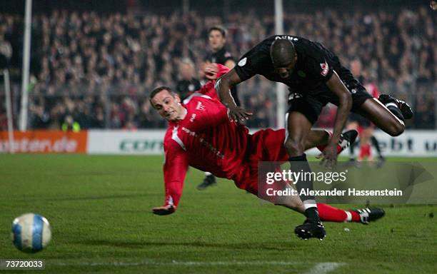 Jasmin Spahic of Emden challenge for the ball with Morike Sako of St. Pauli during the Third League match between FC St.Pauli and Kickers Emden at...