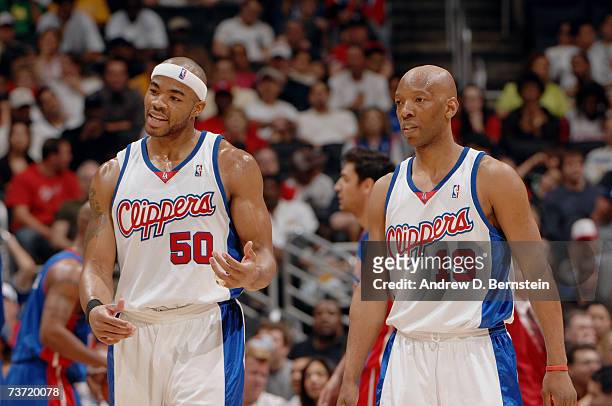 Corey Maggette and Sam Cassell of the Los Angeles Clippers talk as they walk off the court during the game against the Detroit Pistons at Staples...