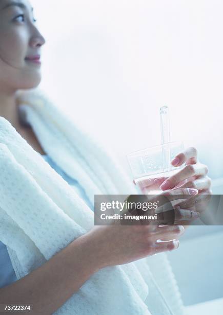 woman brushing teeth - change toothbrush stock pictures, royalty-free photos & images