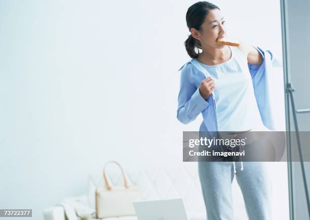 woman getting dressed - top priority stock pictures, royalty-free photos & images